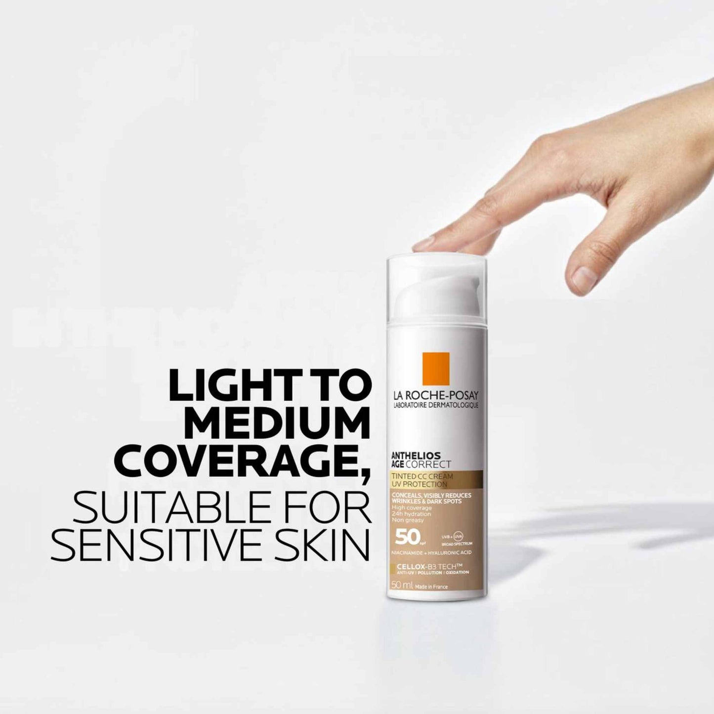 La Roche-Posay Anthelios Age Correct Tinted CC Cream spf50 50mL with a hand holding it on a white background