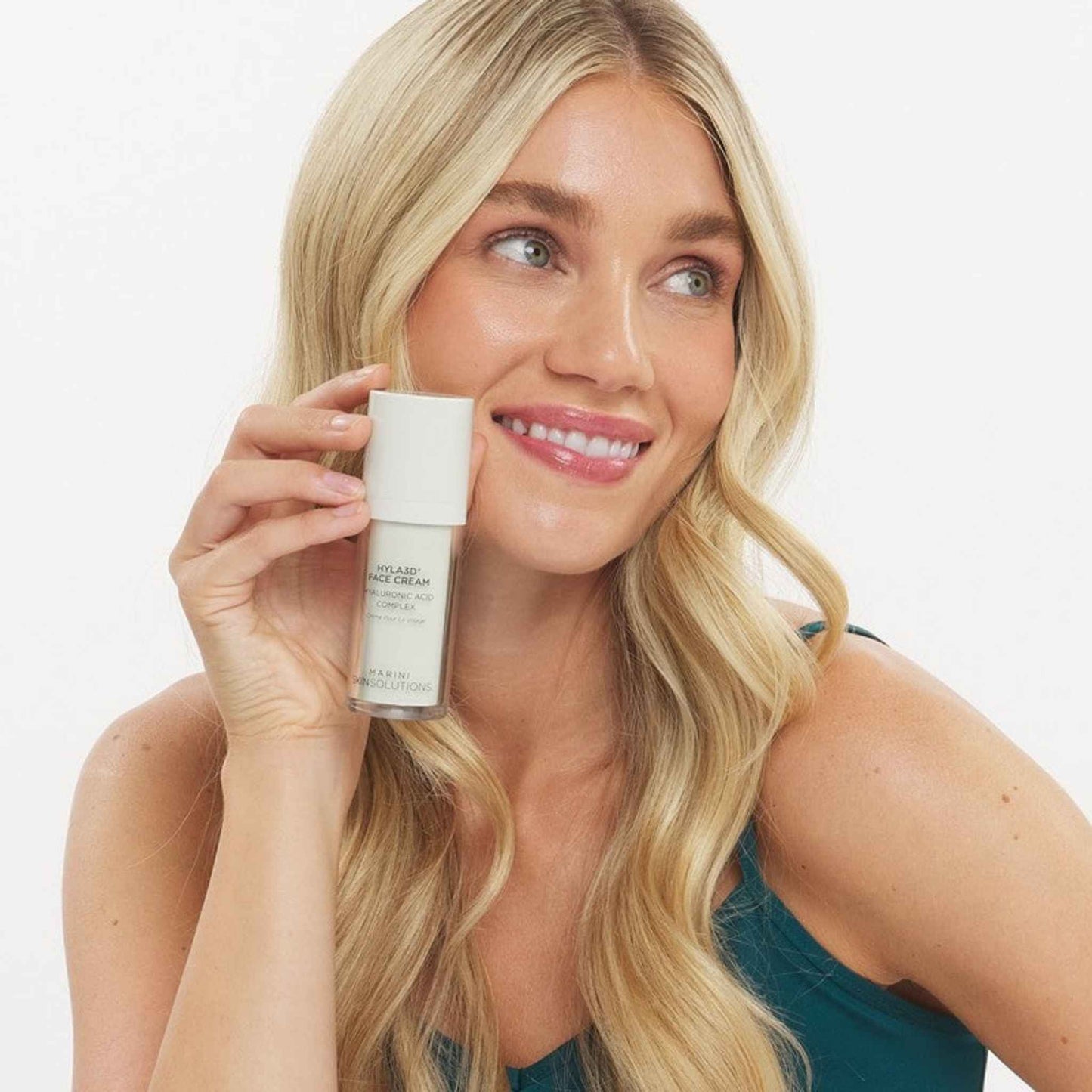 Woman holding a Marini SkinSolutions Hyla3D Face Cream