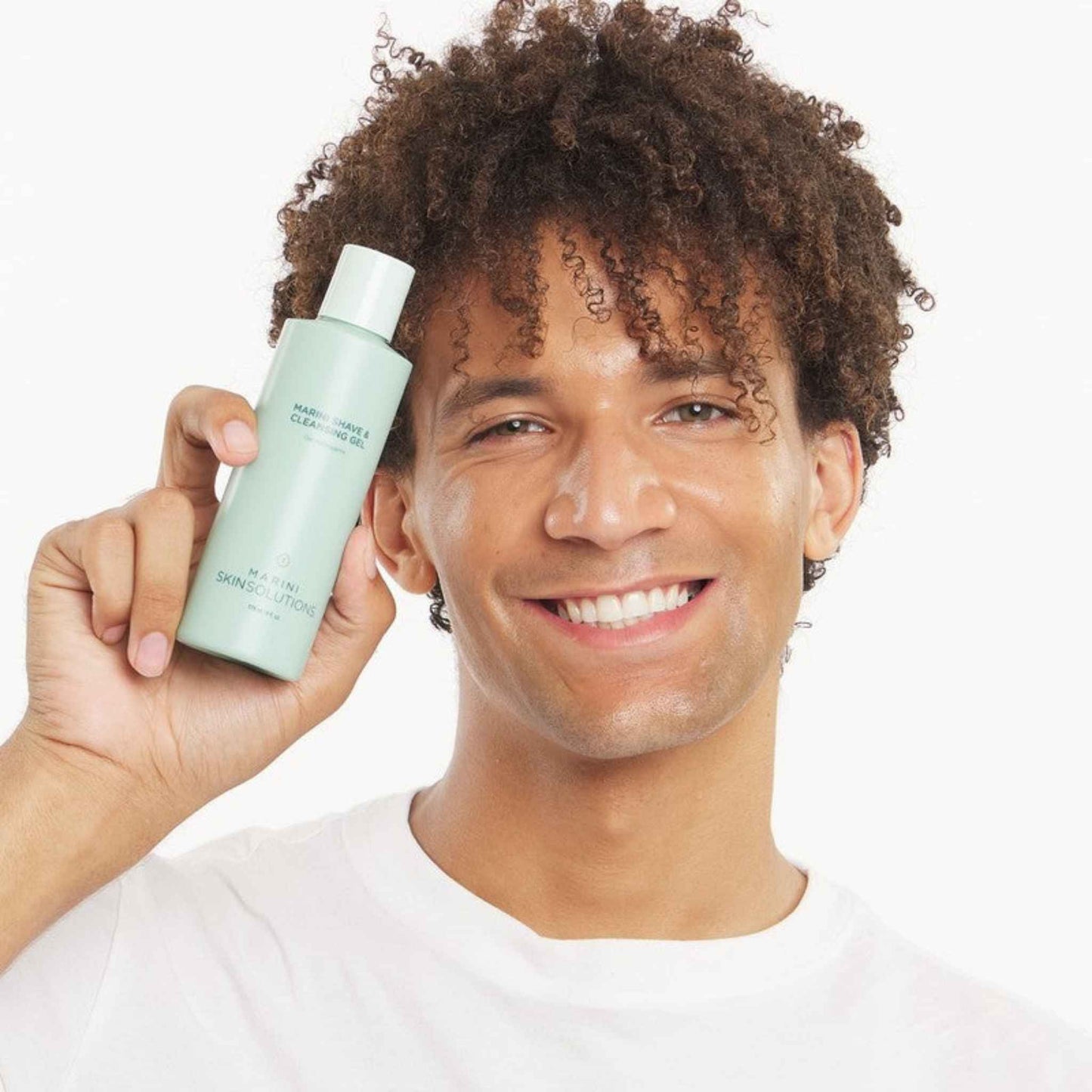 Man holding a Marini SkinSolutions Shave & Cleansing Gel