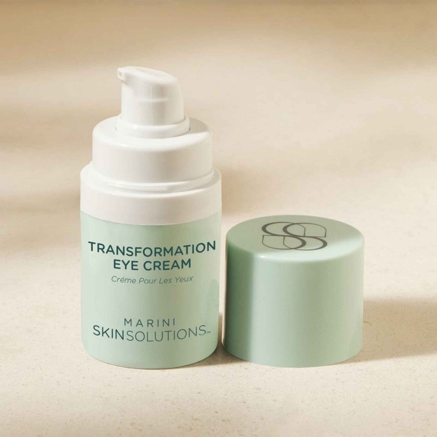 Marini Skinsolutions Transformation Eye Cream with its lid on a beige background